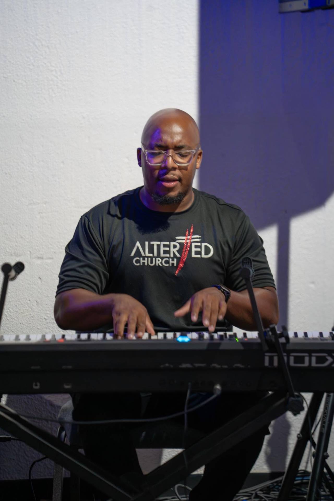 Musician on keys leading worship